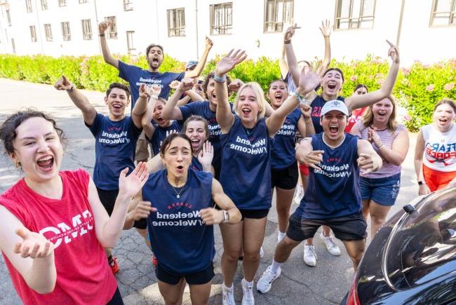 Students cheering at Saint Mary's College wearing Weekend of Welcome Shirts